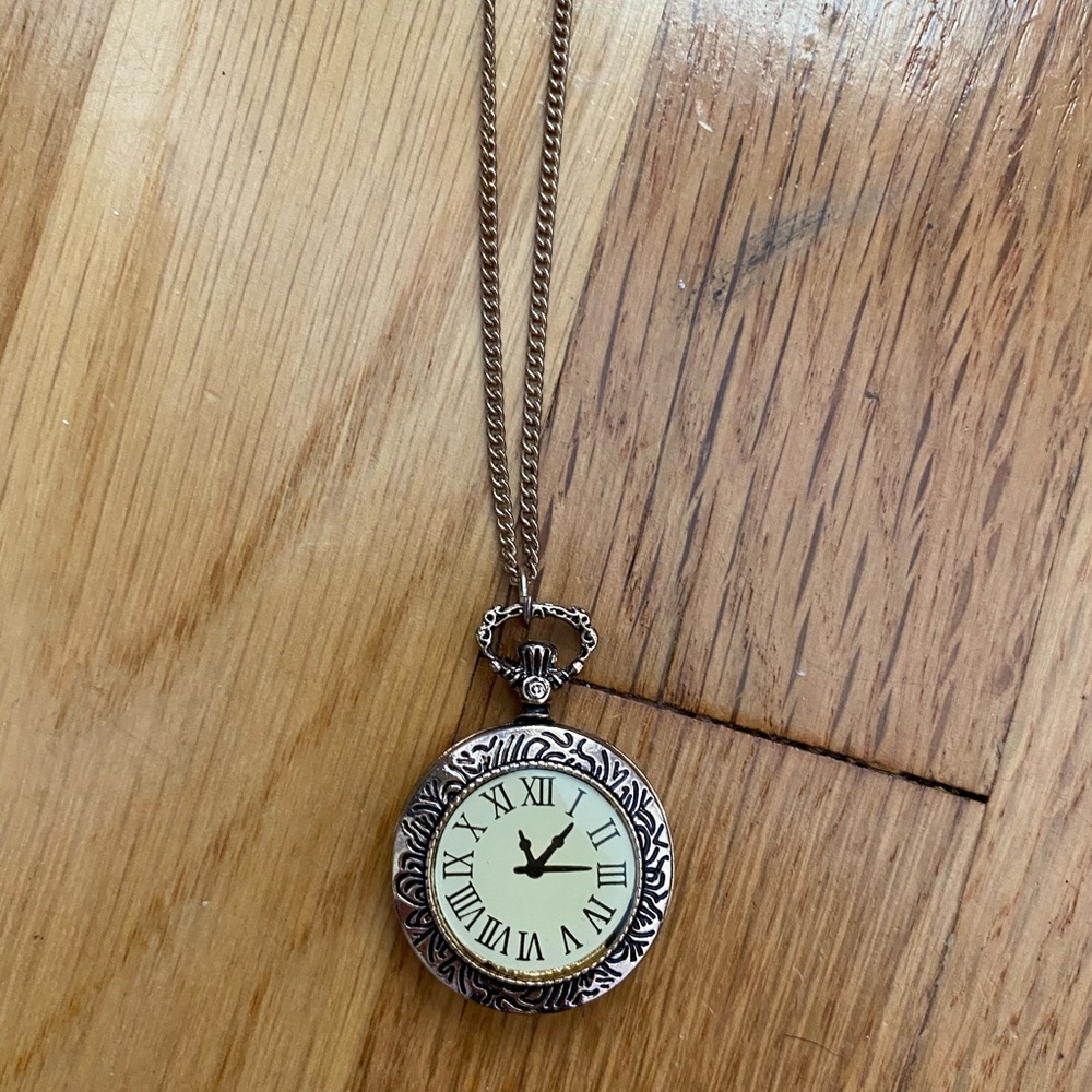 gold timepiece necklace